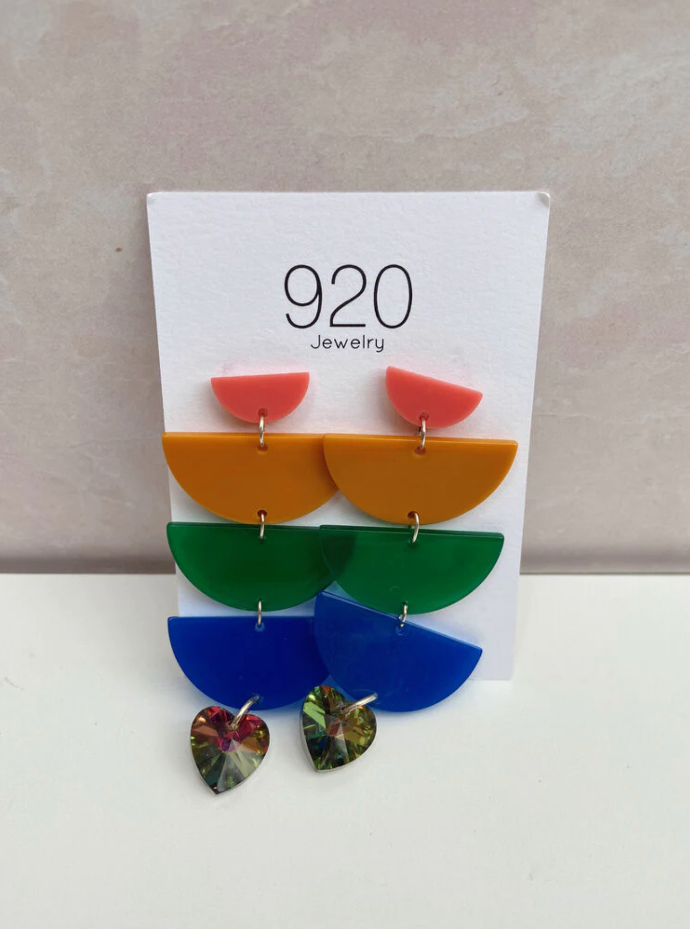 Resin dangly earrings made out of geometric shapes in bright colors made by 920 JEWELRY