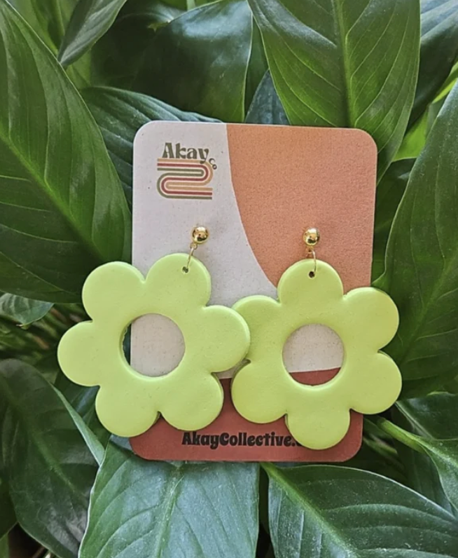 Neon green clay flower earrings created by Akay Collective