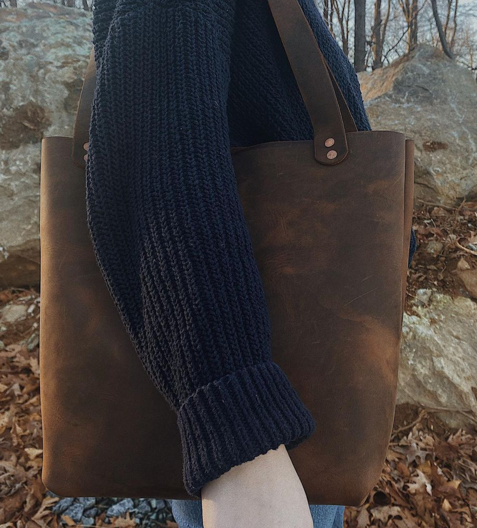 Person holding large leather shoulder bag made by ardor goods