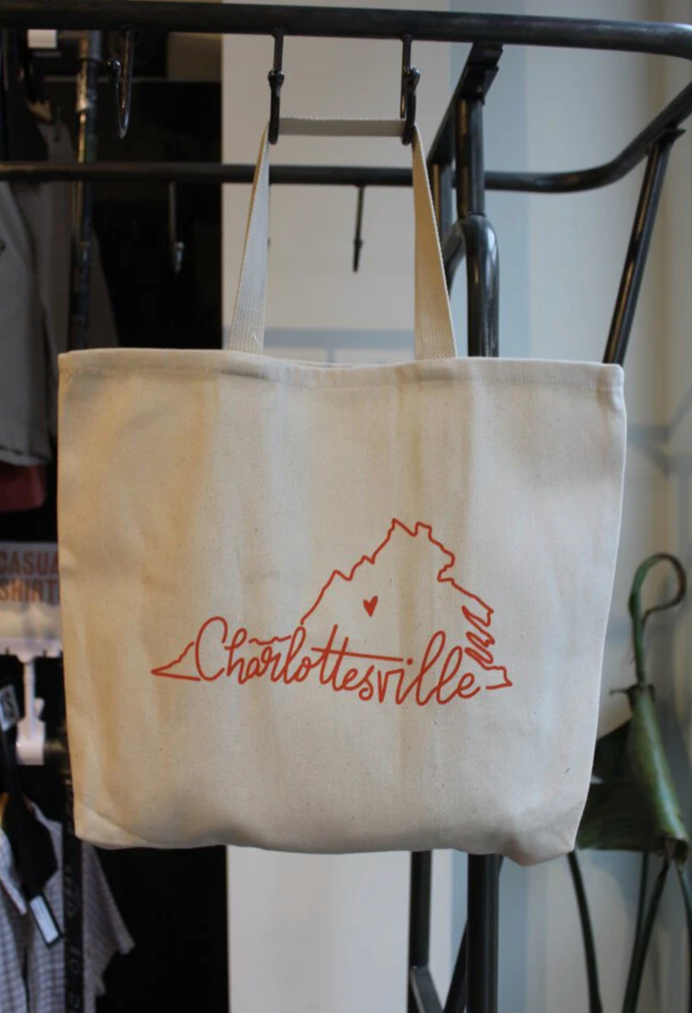 totebag with outline of VA that reads "Charlottesville" in script font, created by Charlottesville Mama