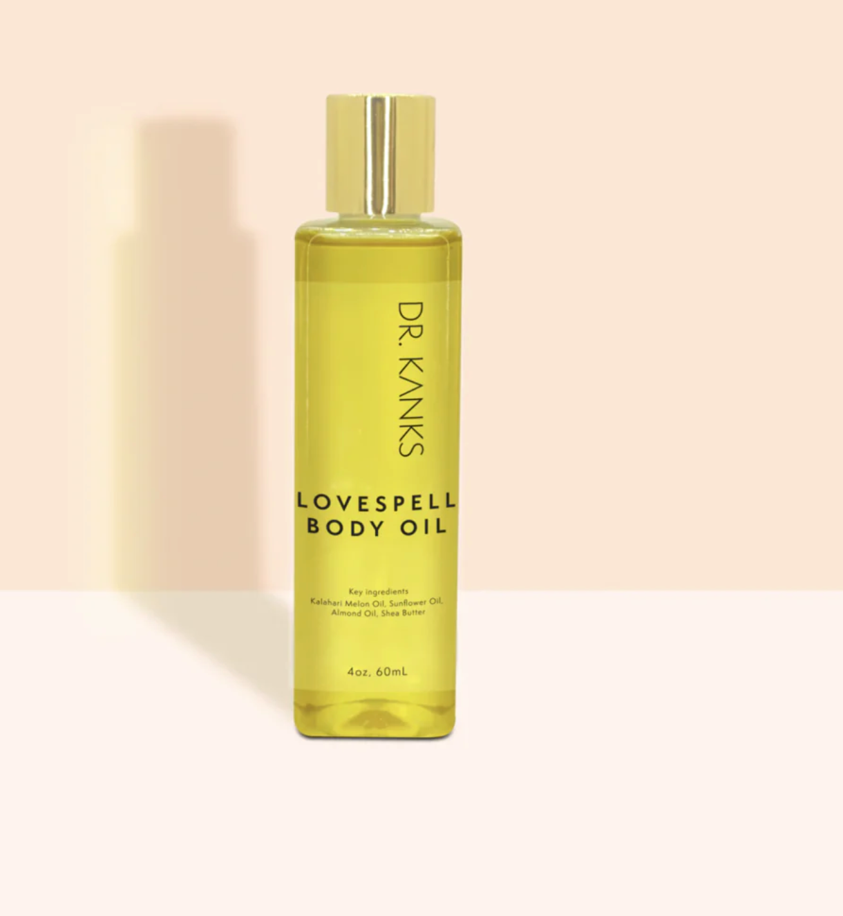 650 ml of Lovespell Body Oil from Dr. Kanks on a neutral back ground