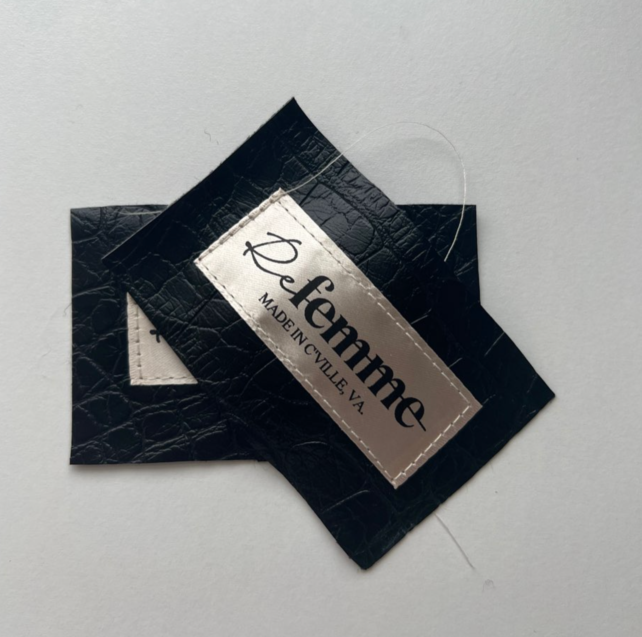 Black Refemme sew-in tags made by Refemme