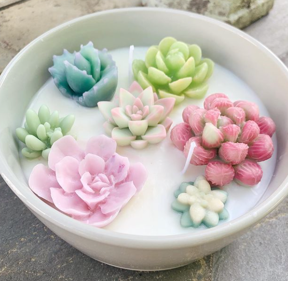 White candle with mini wax succulents in it, made by Simply Summerville